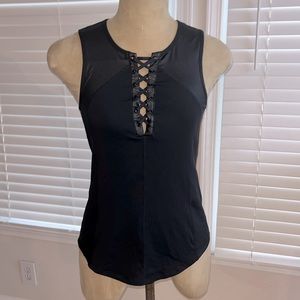 NWOT Women’s athletic top with built in bra. Faux leather details. Never worn S